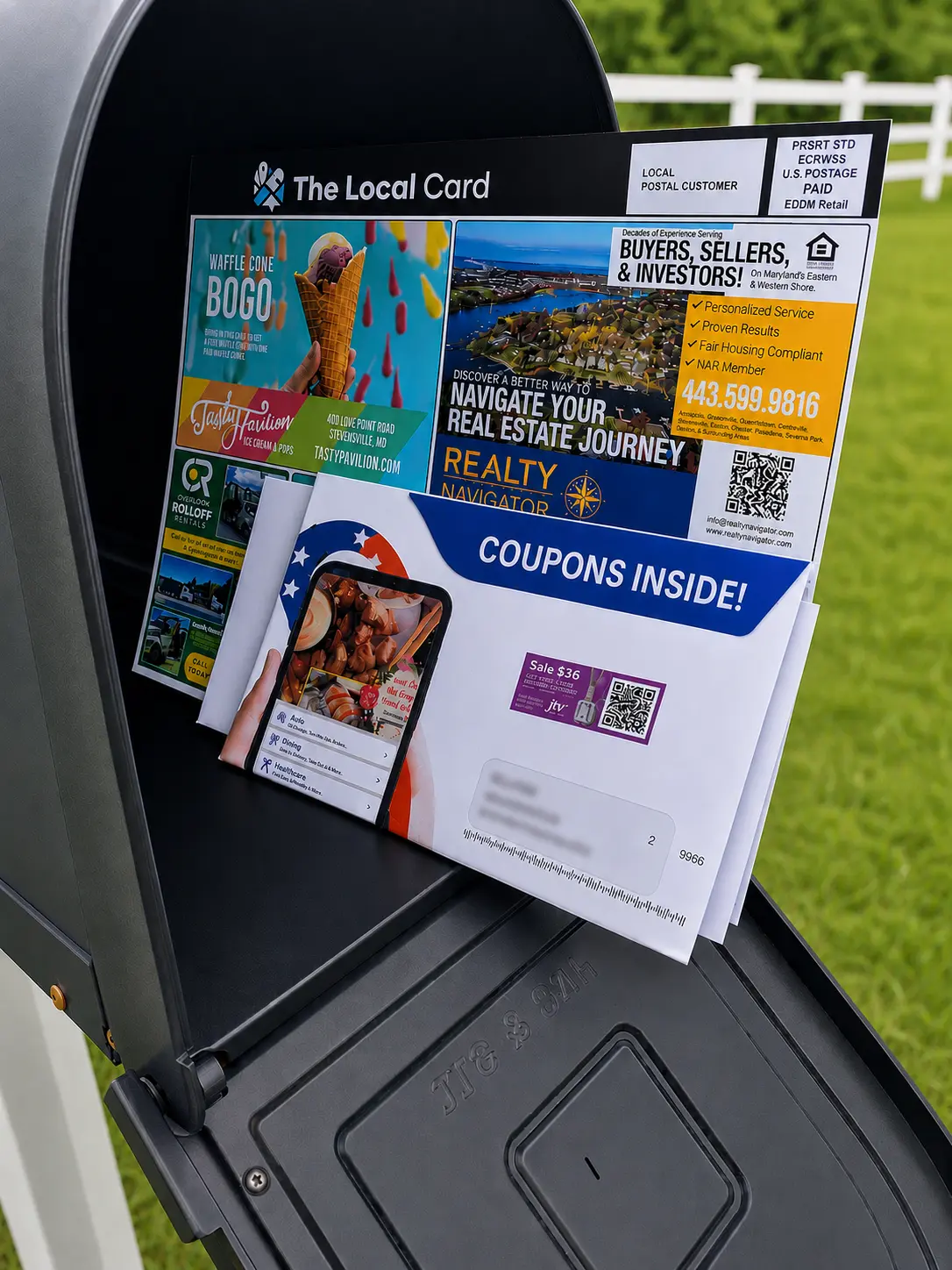 The Local Card postcard standing out above other mail in a mailbox, next to a coupon book envelope